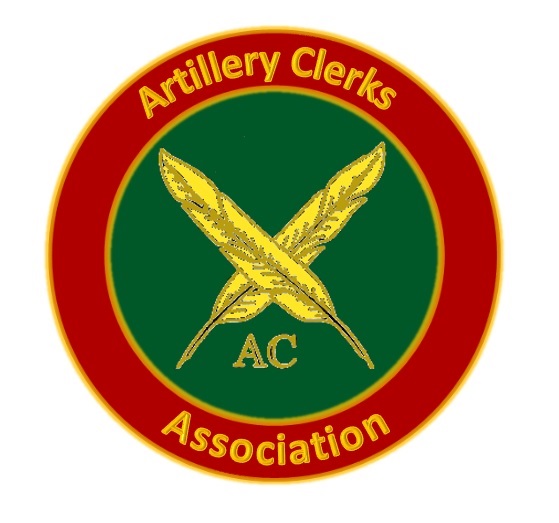 The Artillery Clerks' Association Badge showing two gold crossed quills on a green circular background encircled with a red border and the words <quote>Artillery Clerks' Association</quote> in gold against a red background